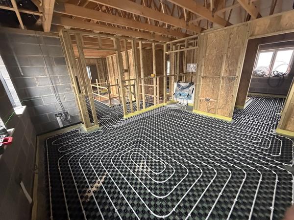 Underfloor heating on studded panels